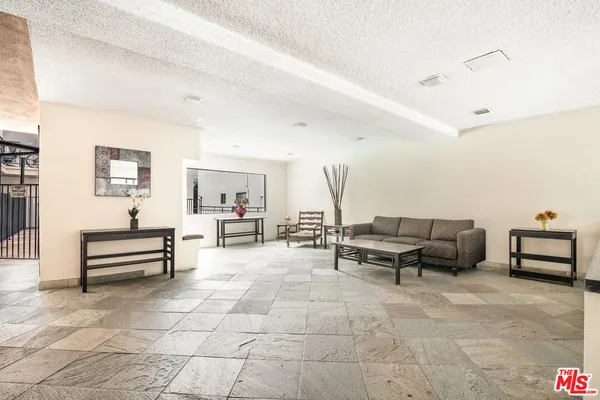 a living room with furniture and a table