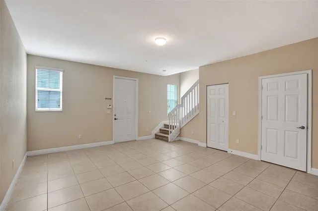 a view of an empty room with a window