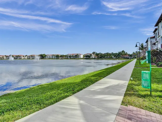 a view of a lake with houses in the back