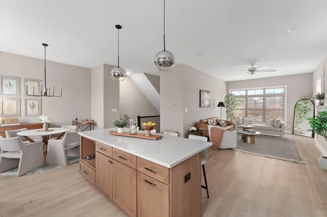 a kitchen that has a lot of cabinets a sink and a stove in it
