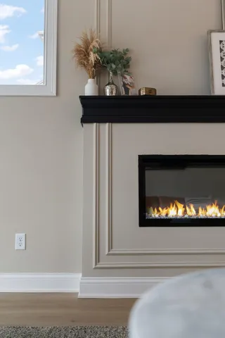a view of fireplace with wooden floor