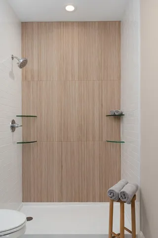 a bathroom with a shower curtain and a toilet