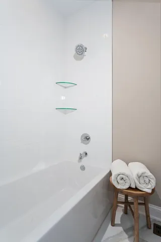 a bathroom with a sink a toilet and bathtub