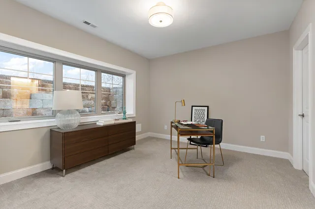 a room with furniture and view of window