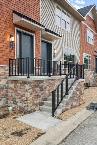 a view of balcony with wooden floor and fence