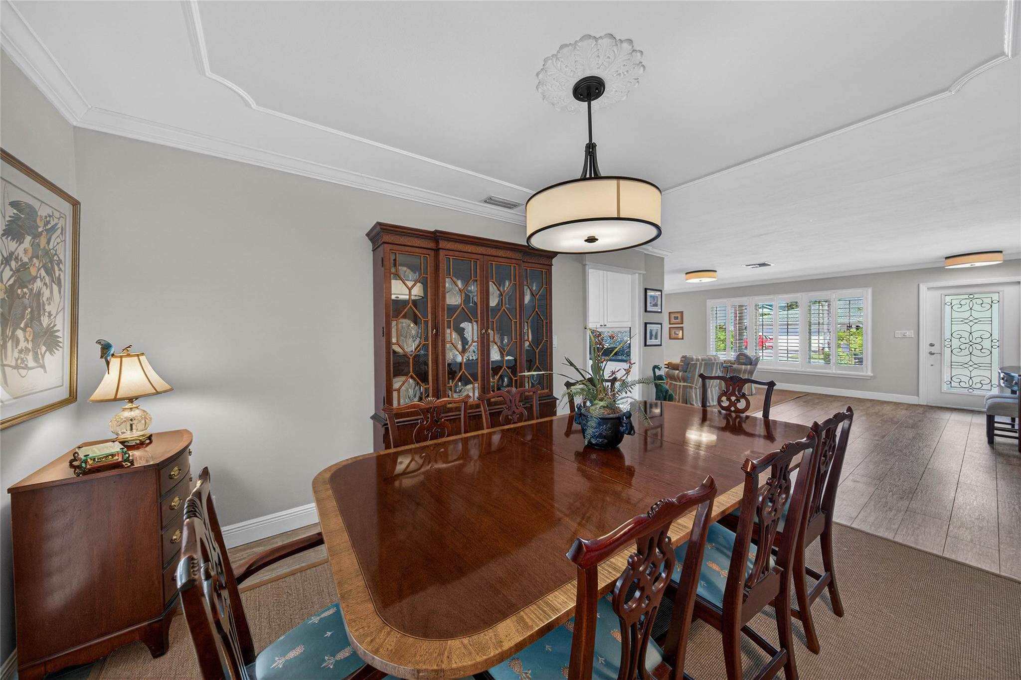 2600 Northeast 46th Street Lighthouse Point, FL 33064 - Photo 12 of 59 a dining room with furniture a chandelier and wooden floor