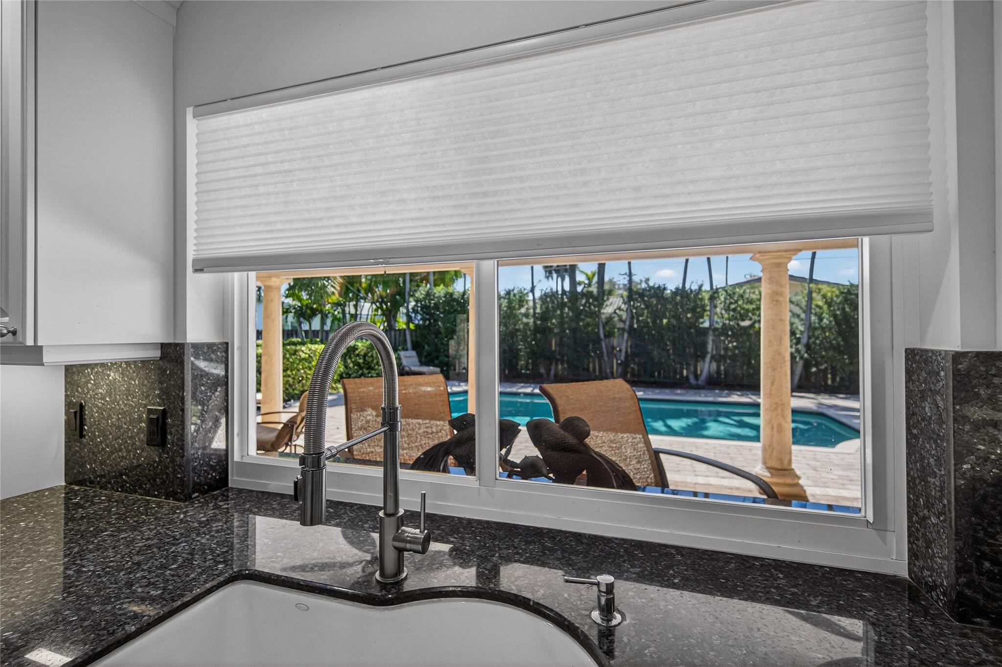 2600 Northeast 46th Street Lighthouse Point, FL 33064 - Photo 17 of 59 a view of a patio with a dining table and chairs