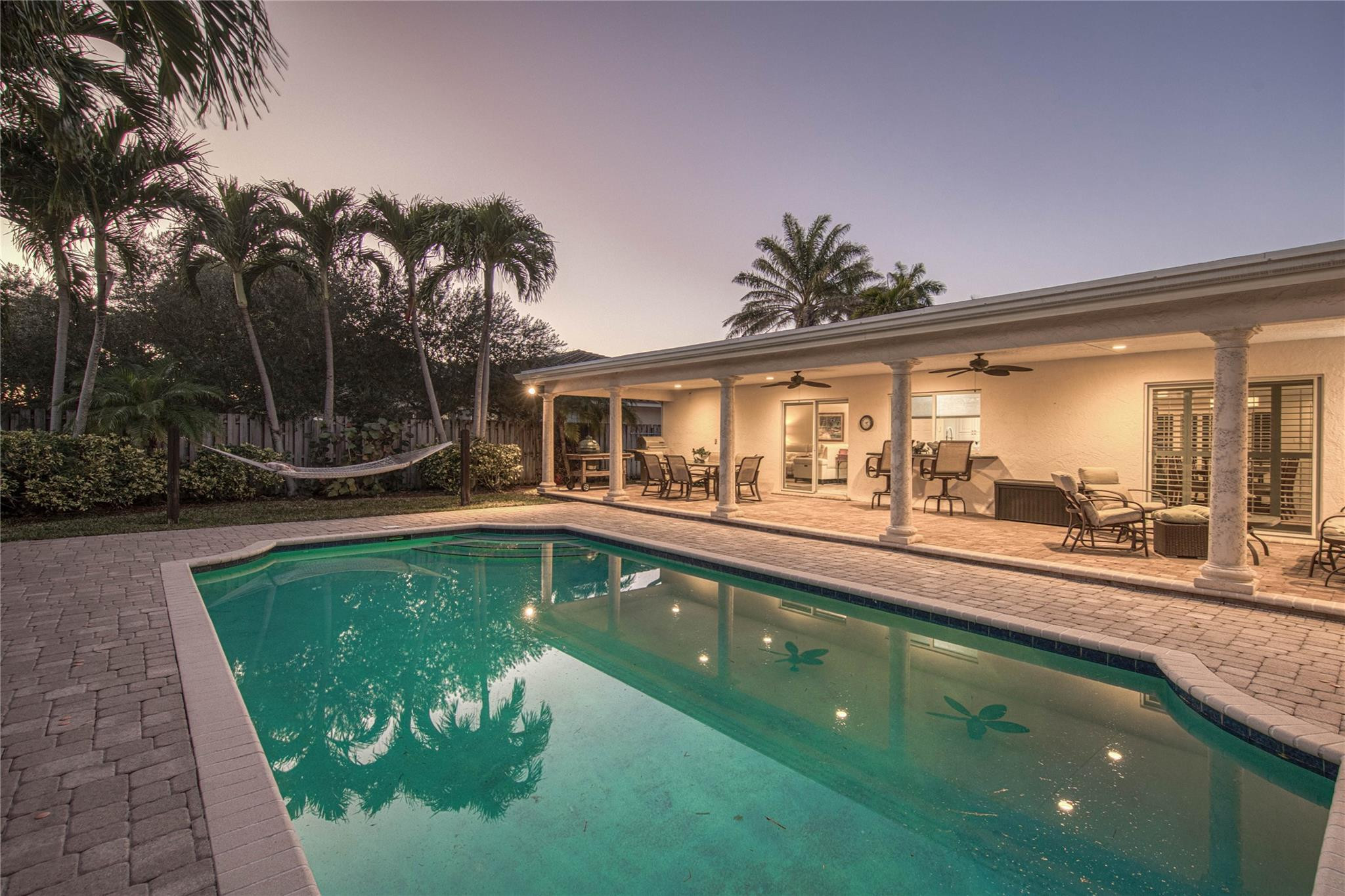 2600 Northeast 46th Street Lighthouse Point, FL 33064 - Photo 2 of 59 a swimming pool view with a garden space