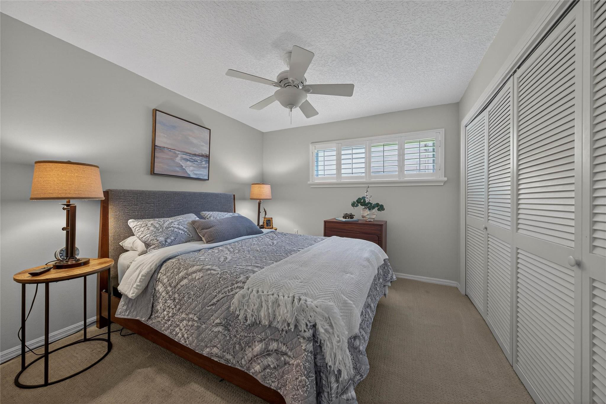 2600 Northeast 46th Street Lighthouse Point, FL 33064 - Photo 25 of 59 a bedroom with a bed and window