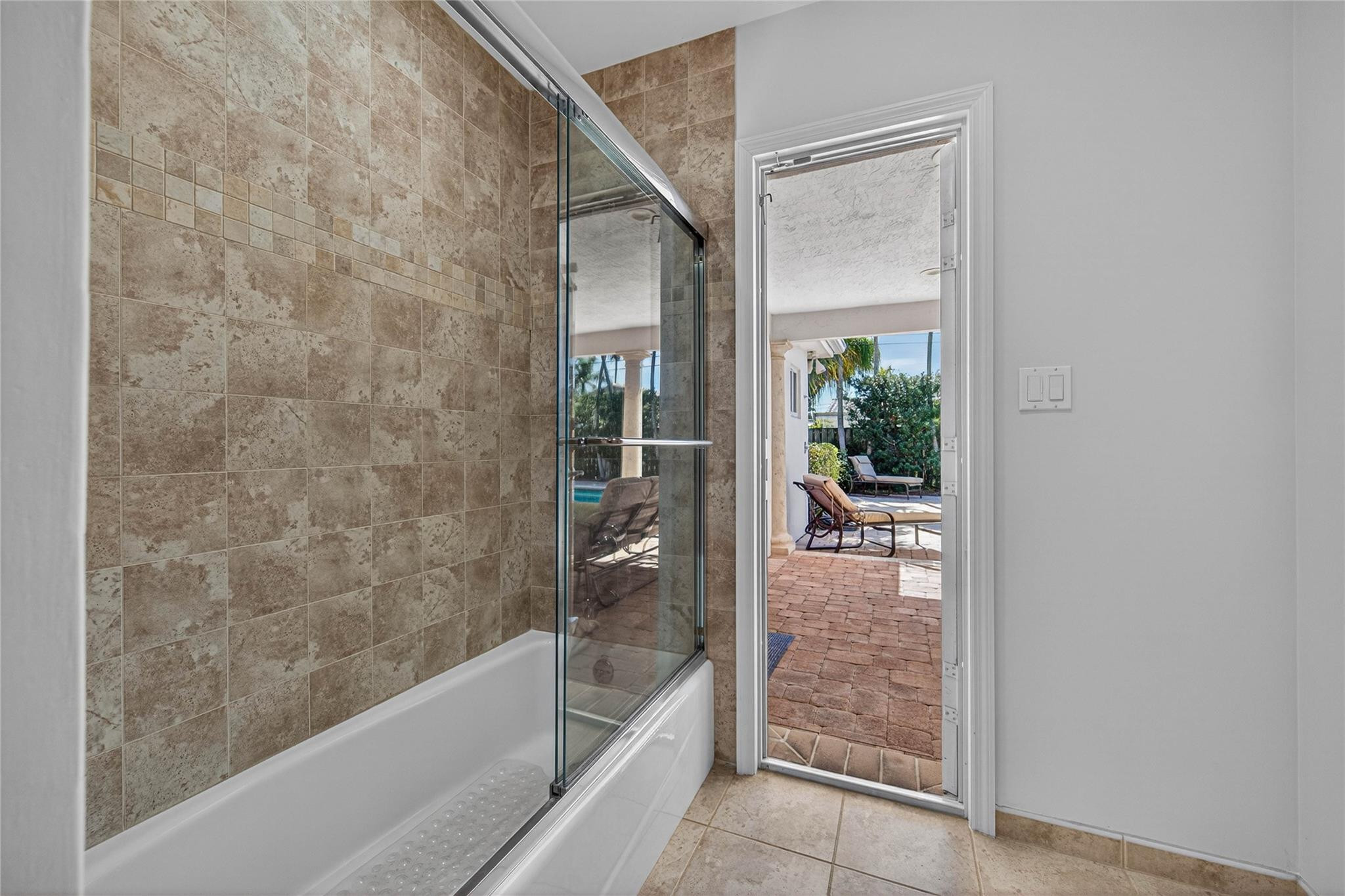 2600 Northeast 46th Street Lighthouse Point, FL 33064 - Photo 28 of 59 a bathroom with a bathtub and a shower