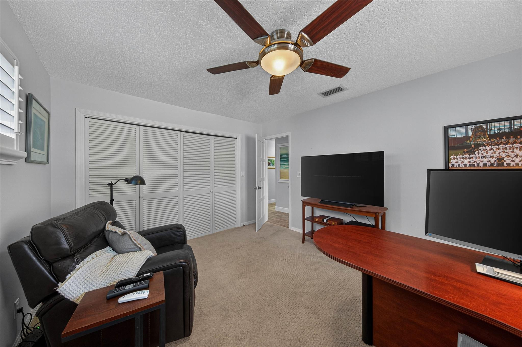 2600 Northeast 46th Street Lighthouse Point, FL 33064 - Photo 30 of 59 a room with furniture and a flat screen tv