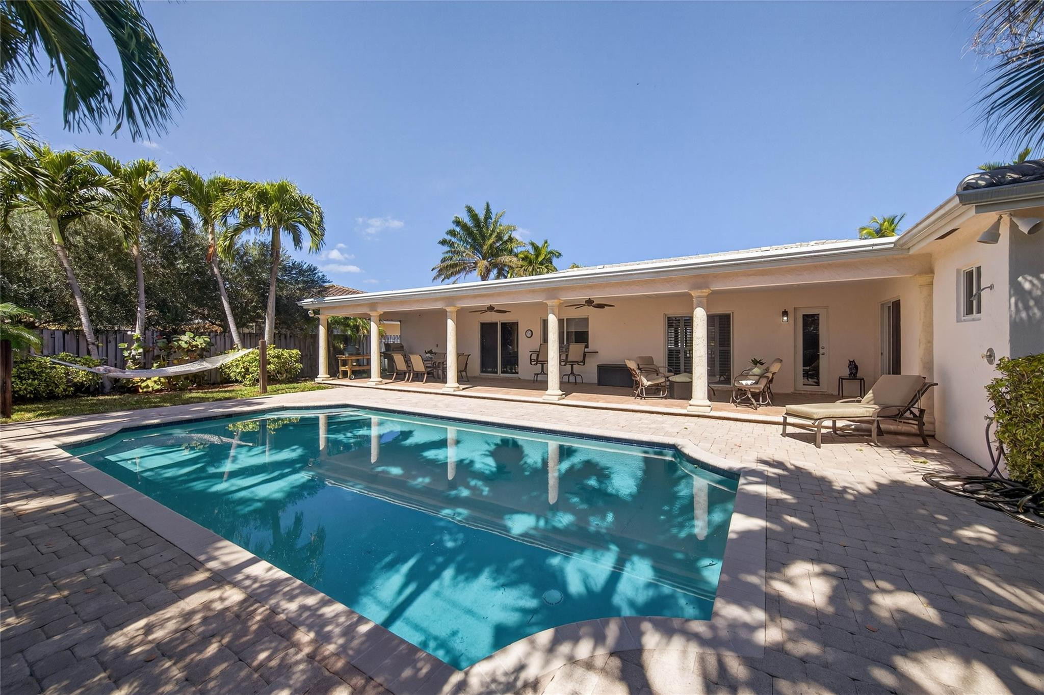 2600 Northeast 46th Street Lighthouse Point, FL 33064 - Photo 3 of 59 a front view of a house with swimming pool