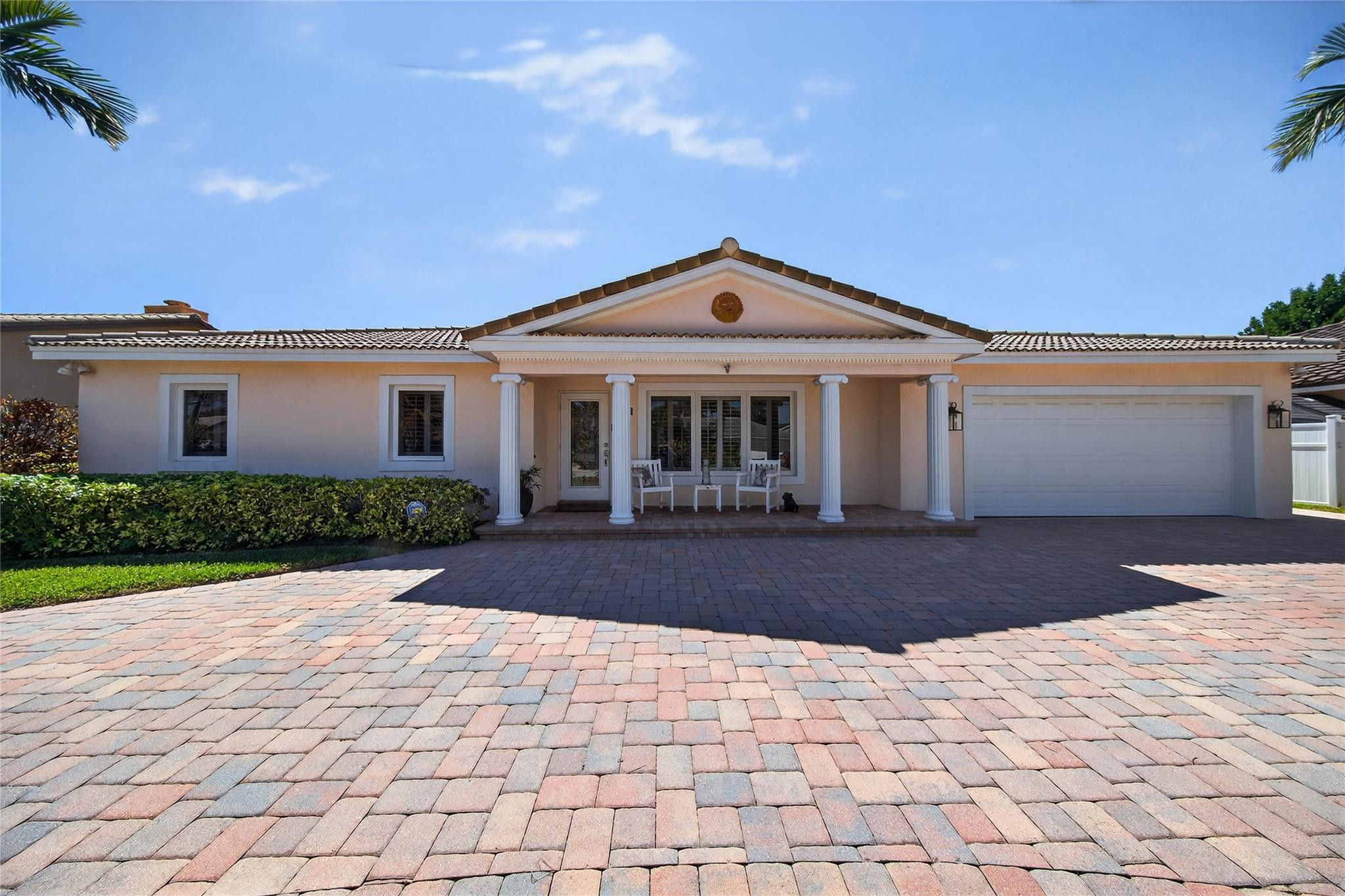 2600 Northeast 46th Street Lighthouse Point, FL 33064 - Photo 35 of 59 a front view of a house with yard and trees