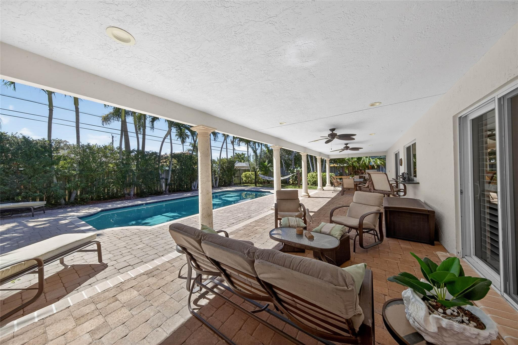 2600 Northeast 46th Street Lighthouse Point, FL 33064 - Photo 40 of 59 a roof deck with couches and potted plants