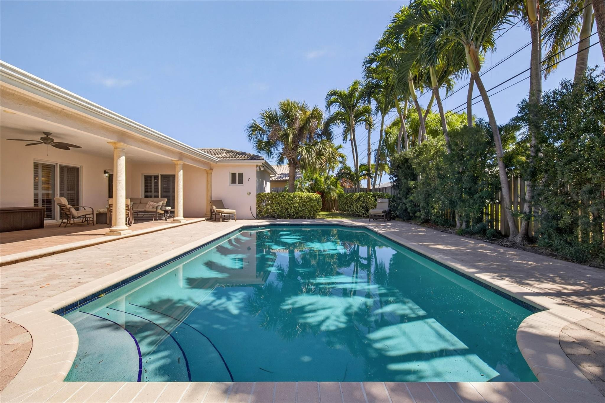 2600 Northeast 46th Street Lighthouse Point, FL 33064 - Photo 44 of 59 a swimming pool with outdoor seating and yard