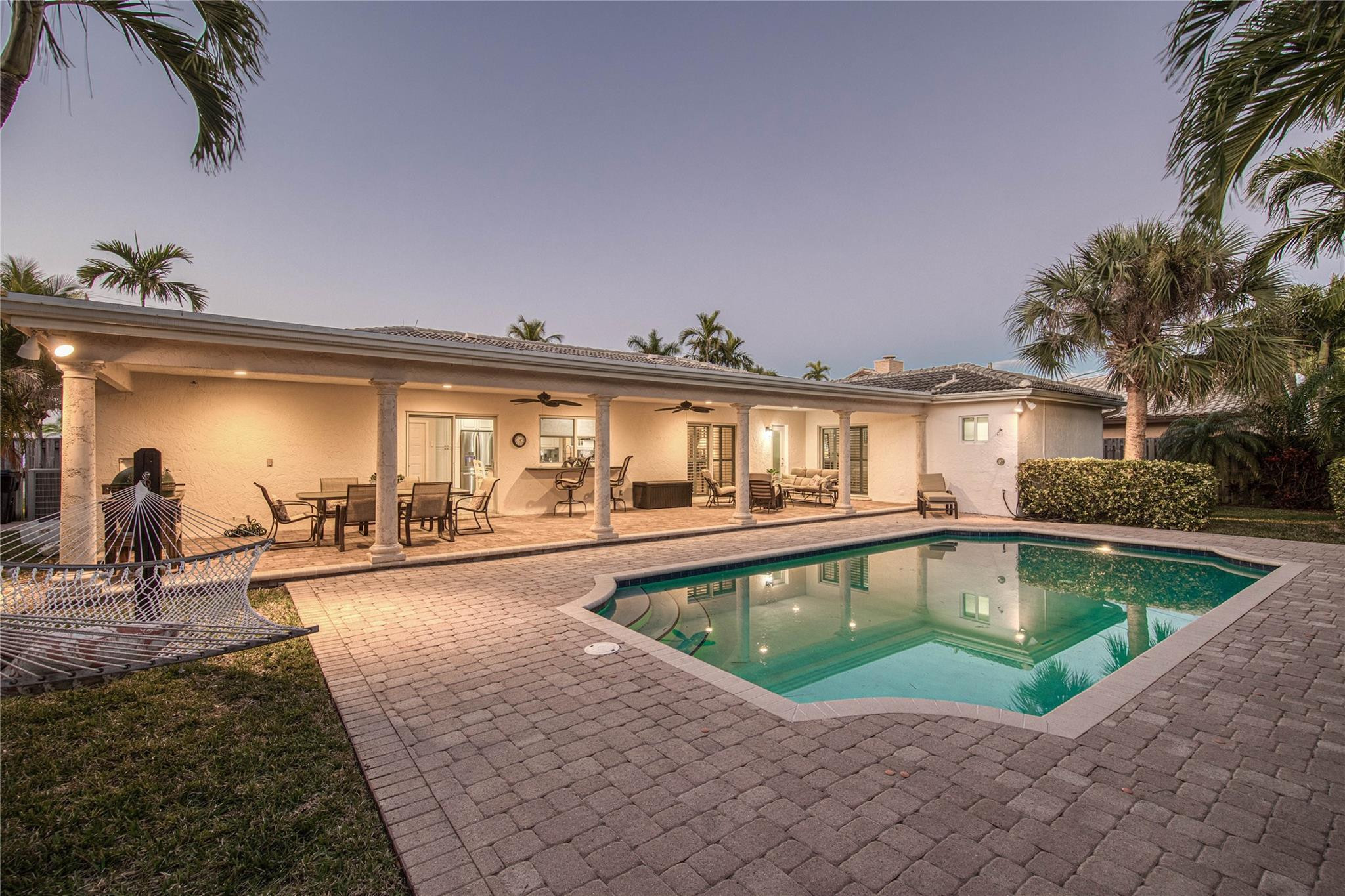 2600 Northeast 46th Street Lighthouse Point, FL 33064 - Photo 50 of 59 a view of a house with swimming pool and sitting area