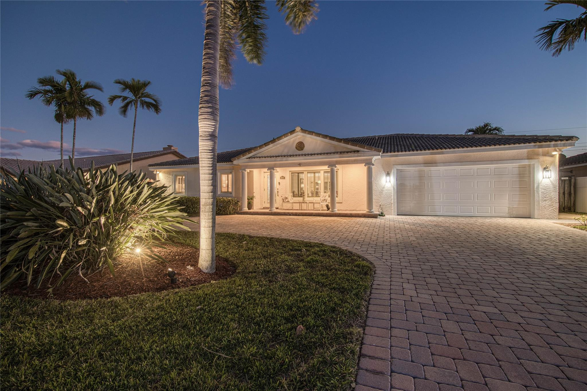 2600 Northeast 46th Street Lighthouse Point, FL 33064 - Photo 58 of 59 a front view of a house with a yard
