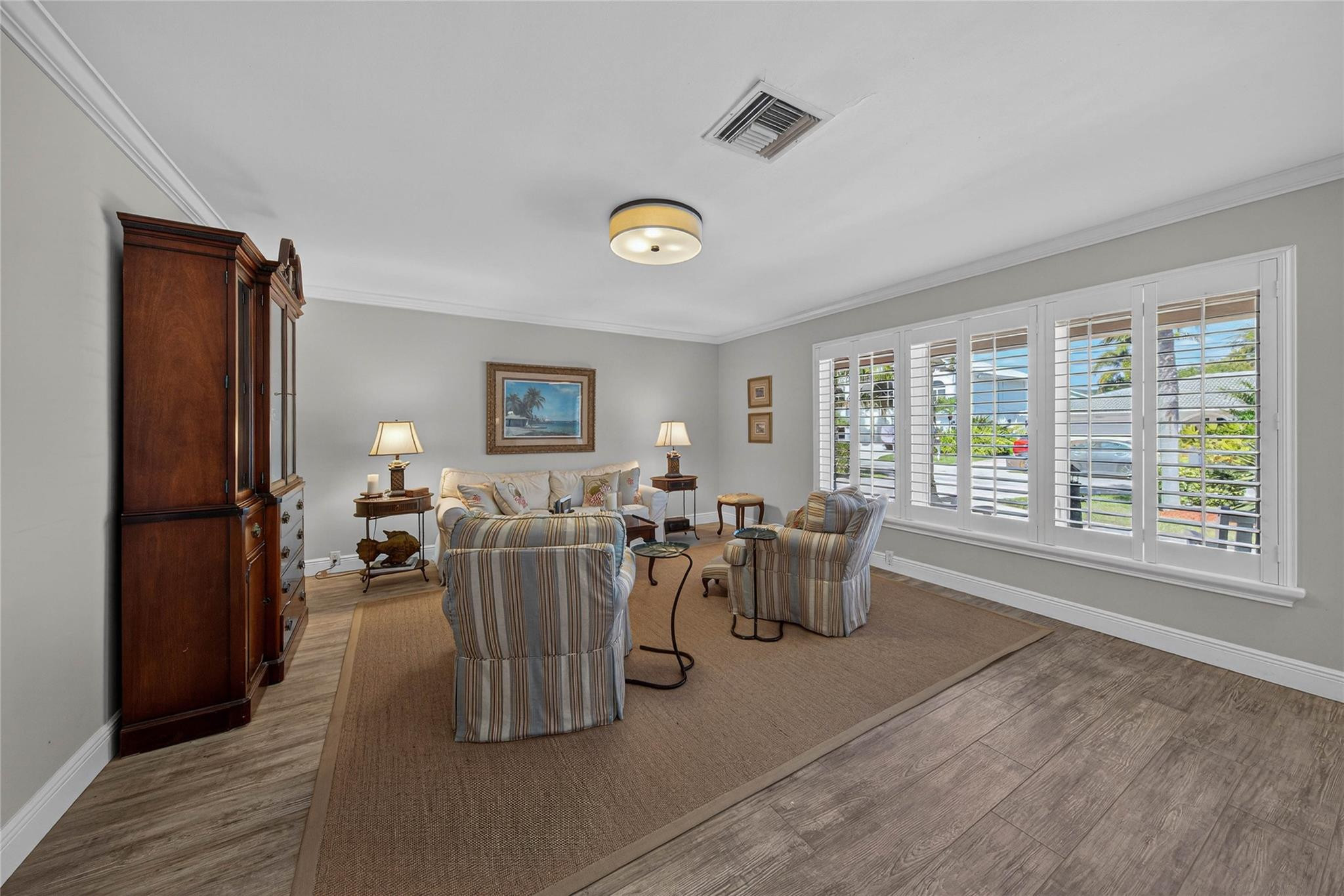 2600 Northeast 46th Street Lighthouse Point, FL 33064 - Photo 8 of 59 a living room with lots of furniture and a large window