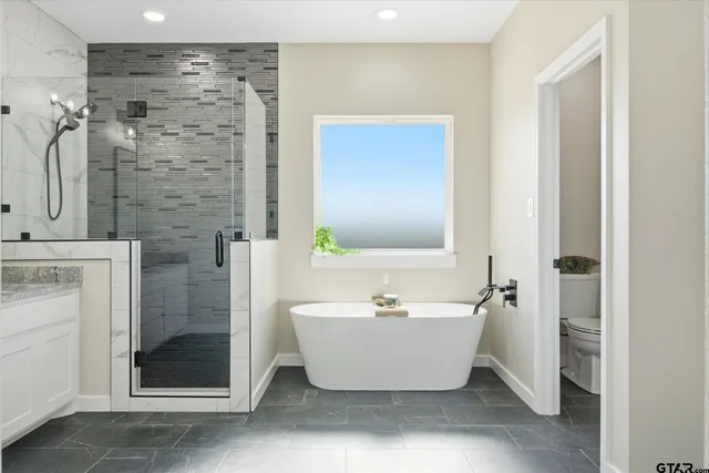 a bathroom with a bathtub and shower