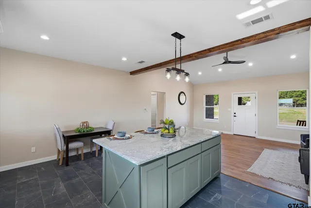 a living room with furniture and a table
