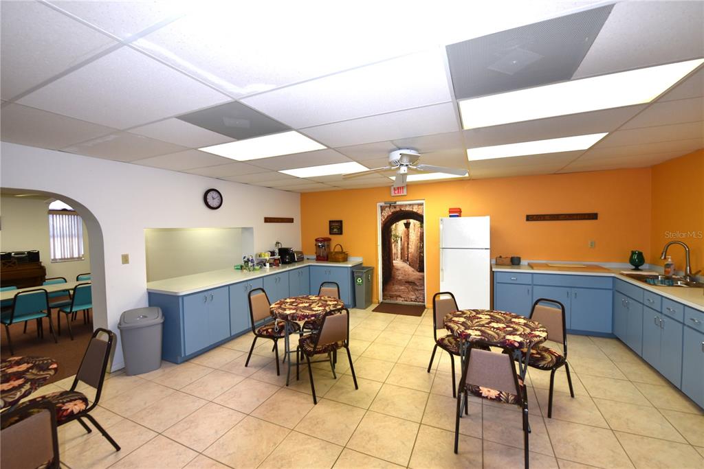 630 Union Street Dunedin, FL 34698 - Photo 25 of 37 a view of a dining room with furniture and chandelier