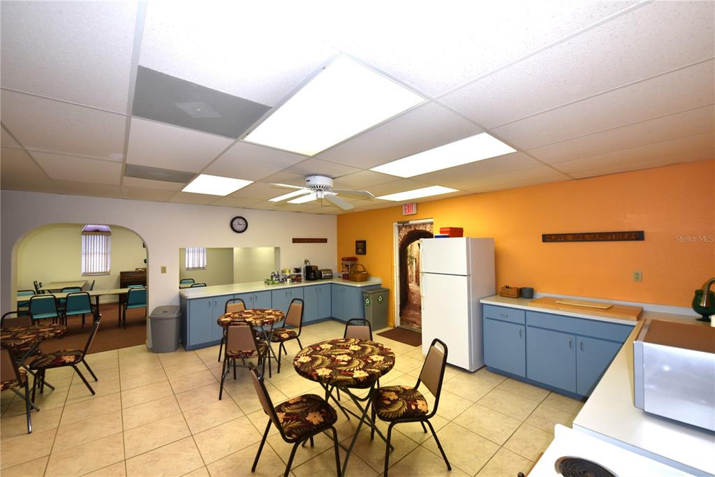 630 Union Street Dunedin, FL 34698 - Photo 26 of 37 a view of a dining room with furniture and a chandelier