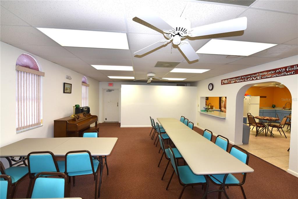 630 Union Street Dunedin, FL 34698 - Photo 28 of 37 a living room with furniture and a chandelier