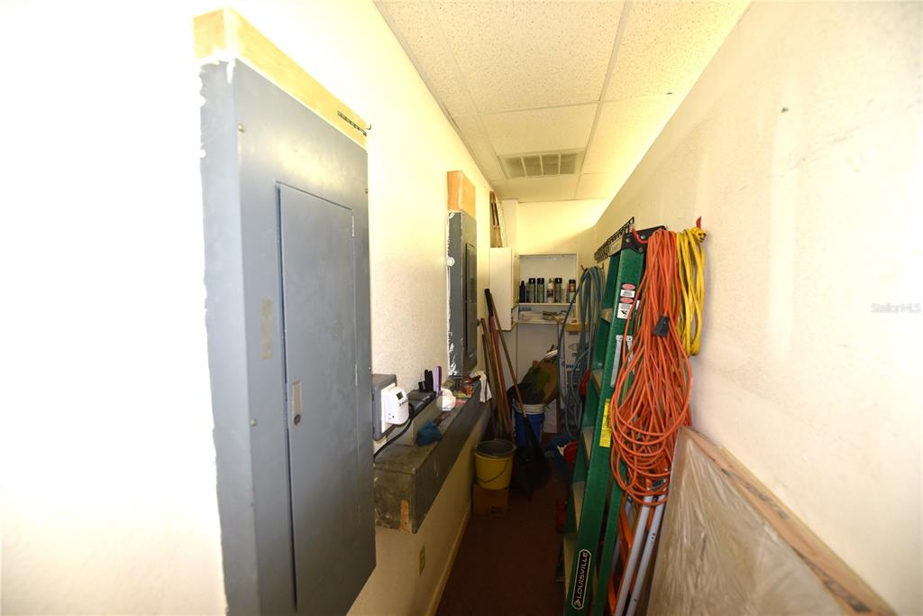 630 Union Street Dunedin, FL 34698 - Photo 34 of 37 a view of walk in closet with clothes and shoes