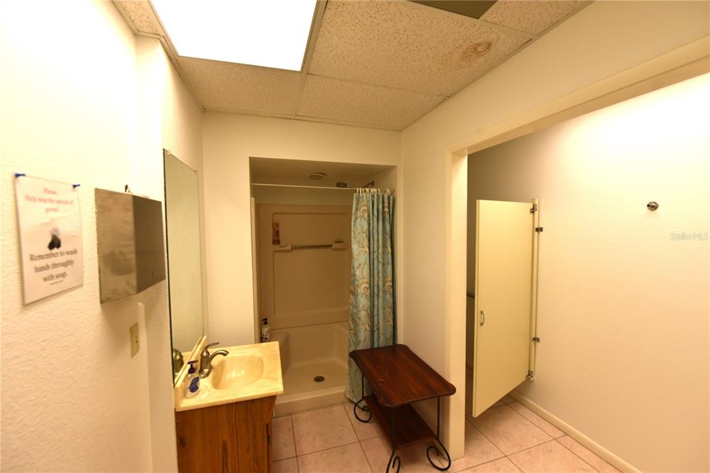 630 Union Street Dunedin, FL 34698 - Photo 37 of 37 a bathroom with a tub and shower