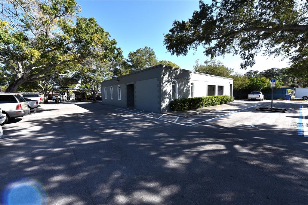 630 Union Street Dunedin, FL 34698 - Photo 9 of 37 a view of a street with trees on both side