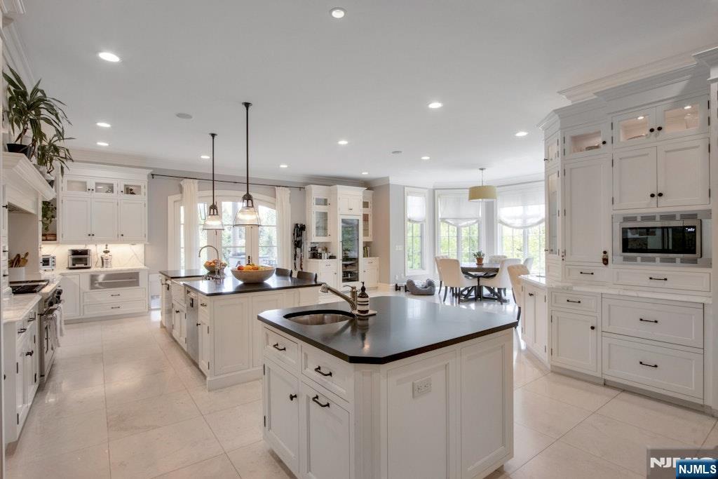 19 Autumn Terrace Alpine, NJ 07620 - Photo 14 of 33 a kitchen with sink stove and cabinets