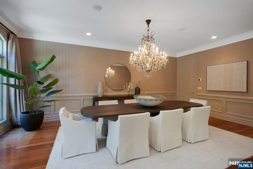 19 Autumn Terrace Alpine, NJ 07620 - Photo 15 of 45 a dining room with furniture and a chandelier