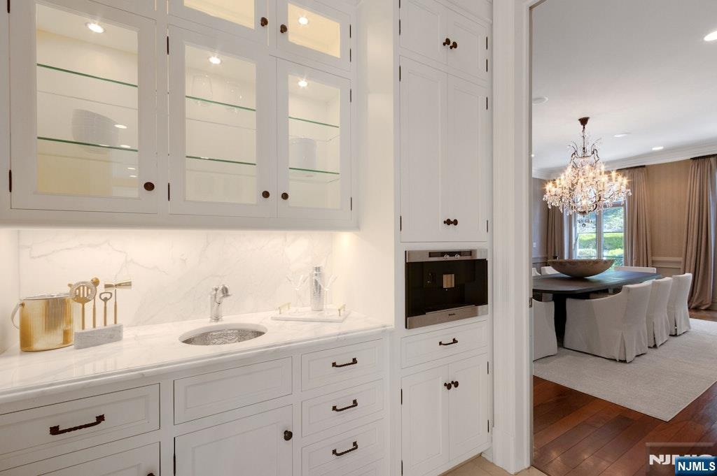 19 Autumn Terrace Alpine, NJ 07620 - Photo 17 of 45 a bathroom with a sink double vanity and tub