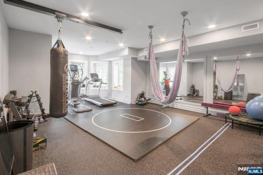 19 Autumn Terrace Alpine, NJ 07620 - Photo 18 of 33 a bathroom with sink a mirror a bathtub and shower