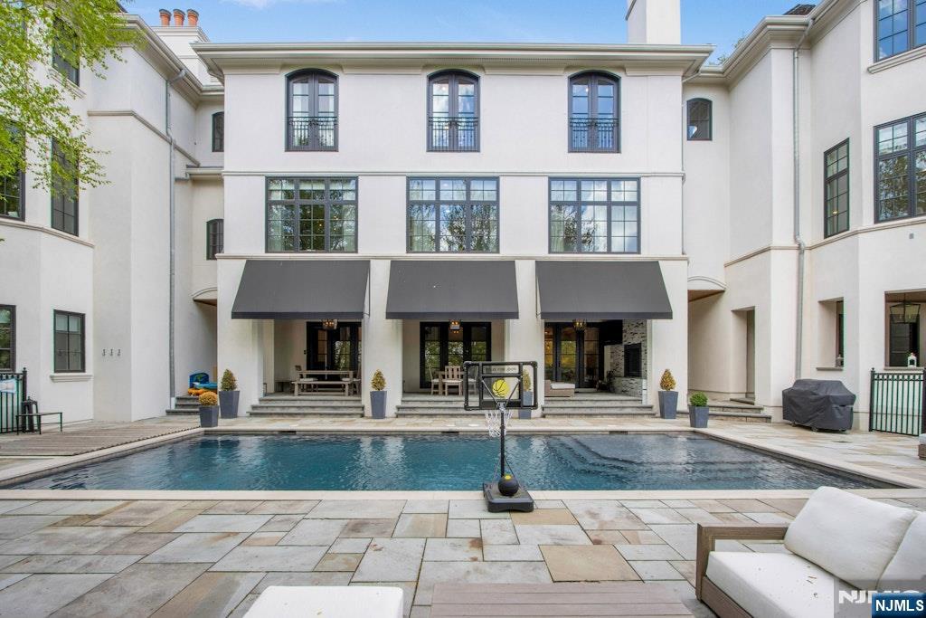 19 Autumn Terrace Alpine, NJ 07620 - Photo 22 of 33 a view of a building with many windows