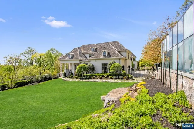 a view of a garden with a building in the background