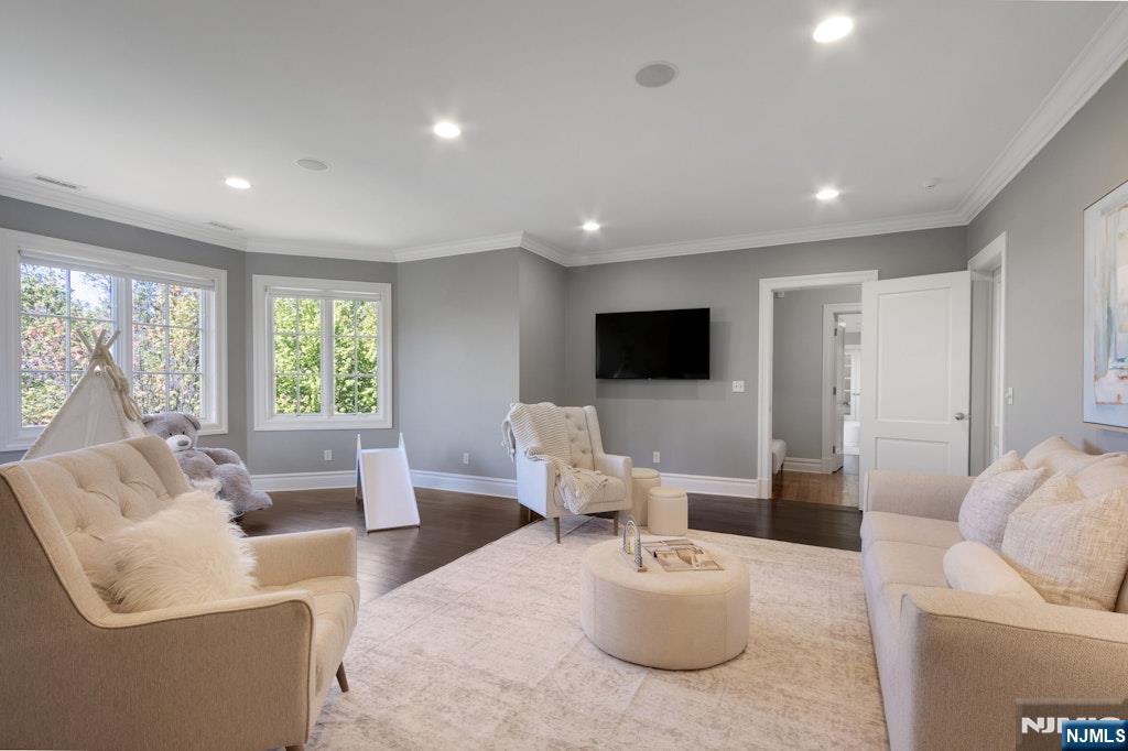 19 Autumn Terrace Alpine, NJ 07620 - Photo 29 of 45 a living room with furniture and a flat screen tv