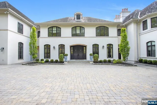 a front view of a house with yard