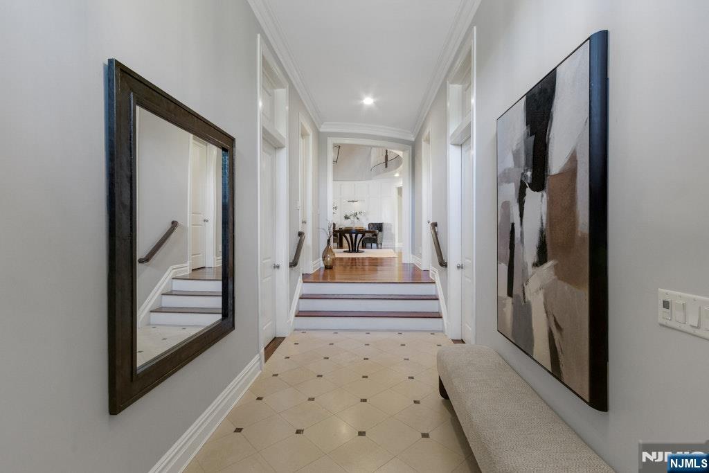 19 Autumn Terrace Alpine, NJ 07620 - Photo 7 of 45 a view of a hallway view with wooden floor and staircase