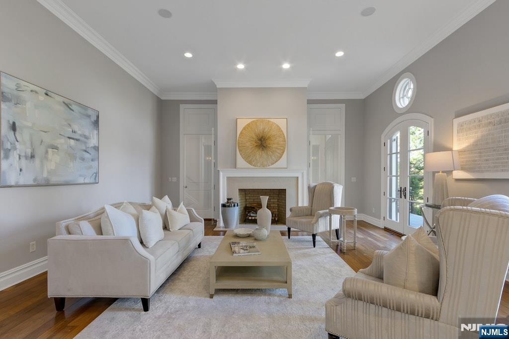 19 Autumn Terrace Alpine, NJ 07620 - Photo 9 of 45 a living room with furniture a fireplace and a large window