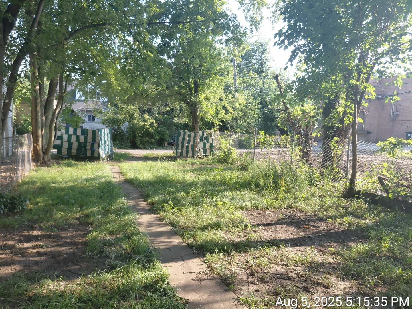 119 East 118th Street Chicago, IL 60628 - Photo 2 of 12 a backyard of a house with a yard and outdoor seating