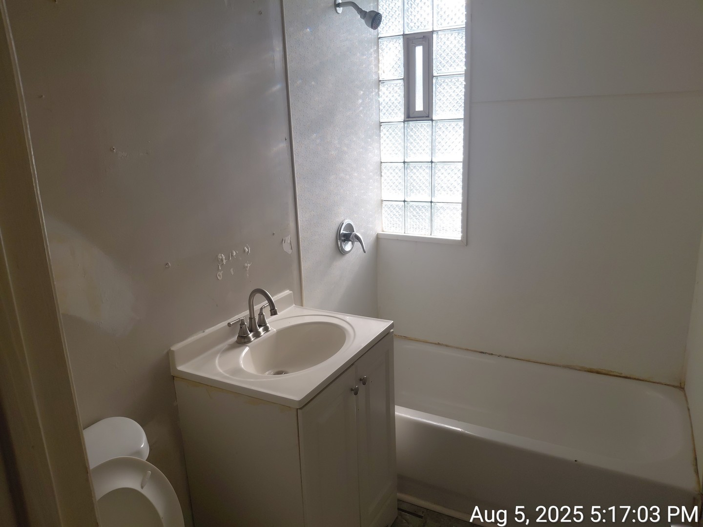 119 East 118th Street Chicago, IL 60628 - Photo 5 of 12 a bathroom with a sink and a vanity