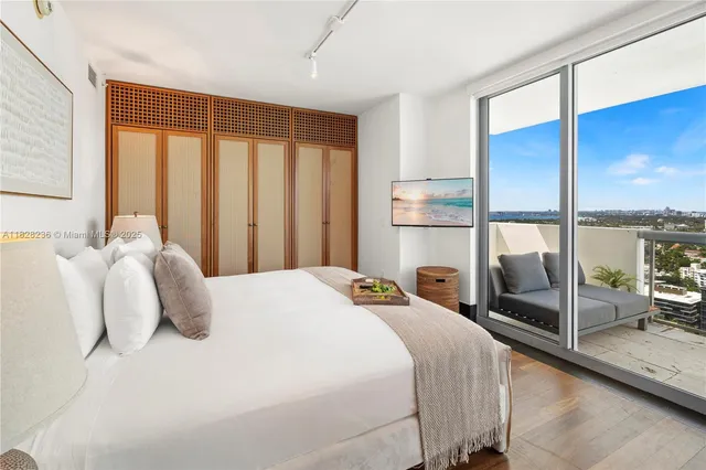 a bedroom with bed and window