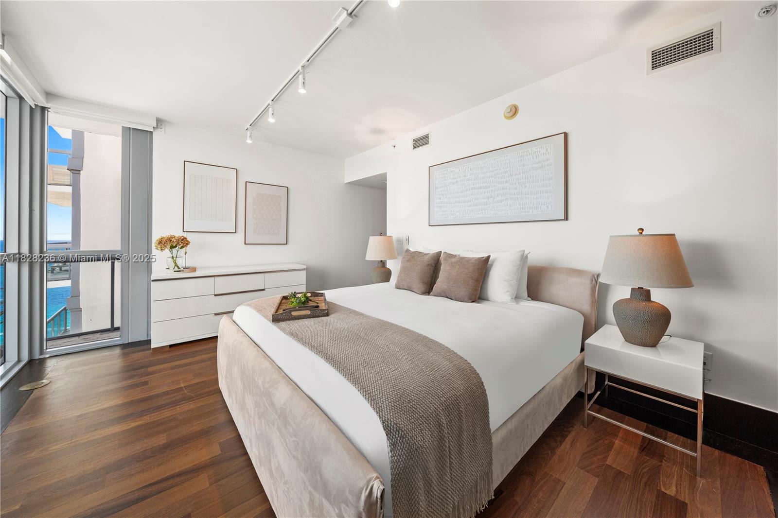 101 20th Street, Unit 3803 Miami Beach, FL 33139 - Photo 13 of 36 a bedroom with bed and window