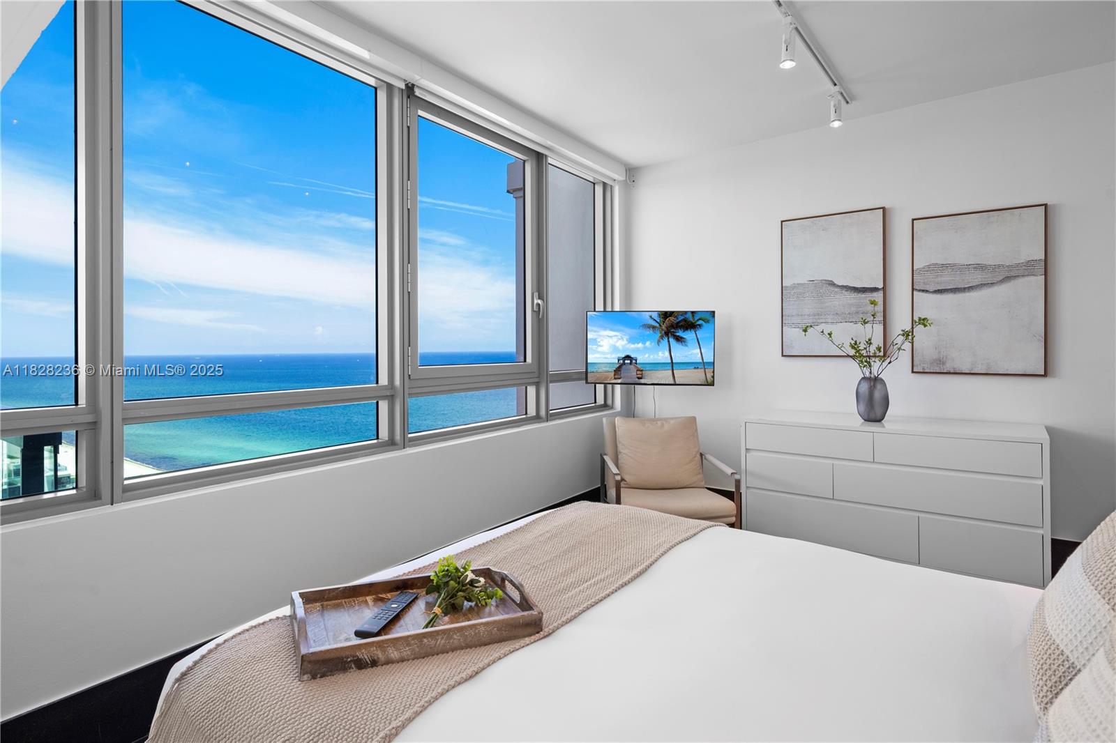 101 20th Street, Unit 3803 Miami Beach, FL 33139 - Photo 19 of 36 a bedroom with a bed and large window