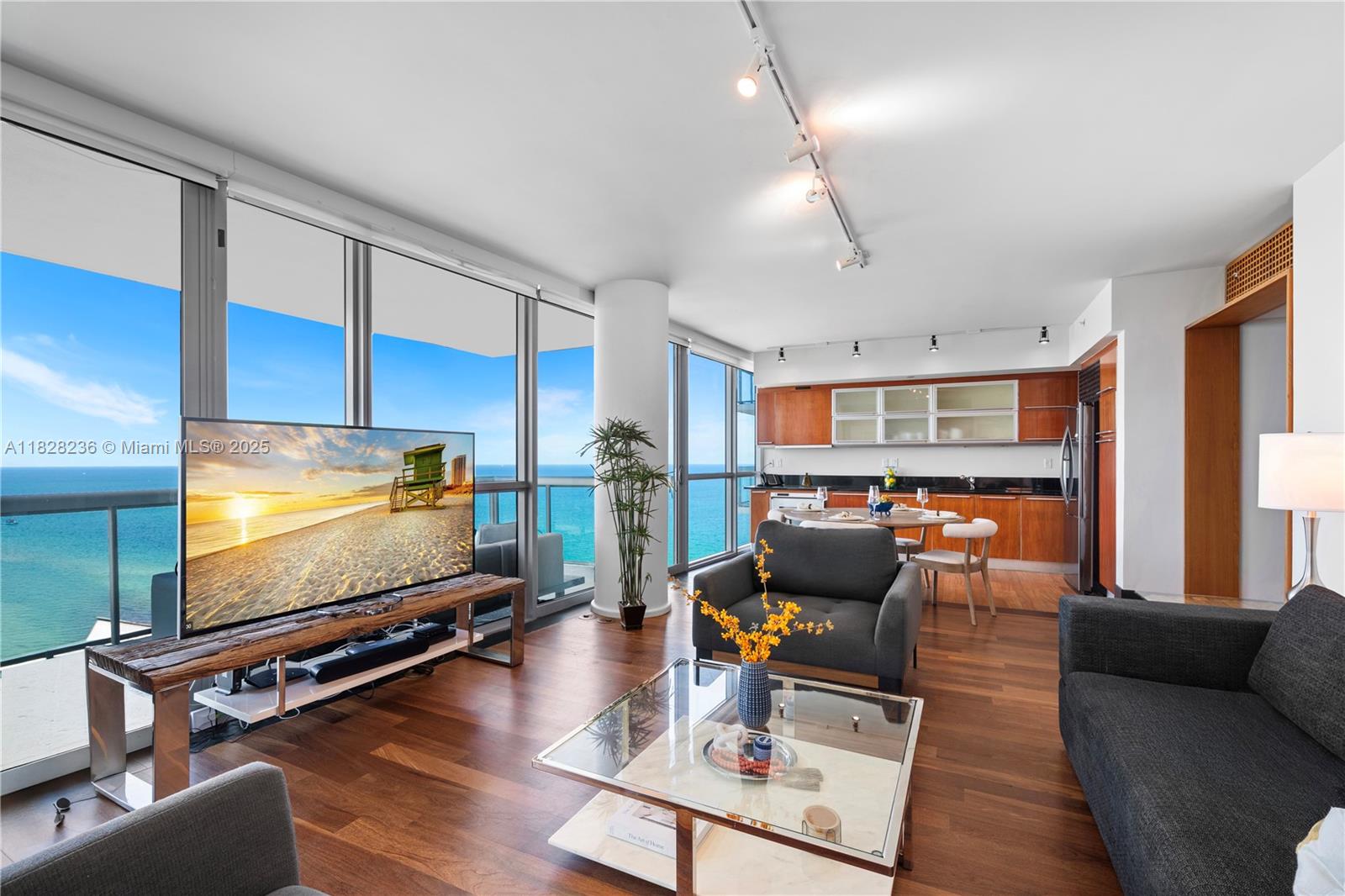 101 20th Street, Unit 3803 Miami Beach, FL 33139 - Photo 3 of 36 a living room with furniture and a flat screen tv