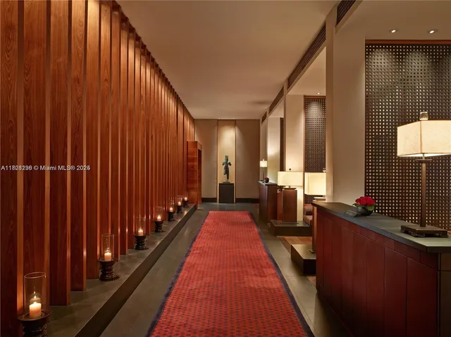 a room with wooden floor and windows