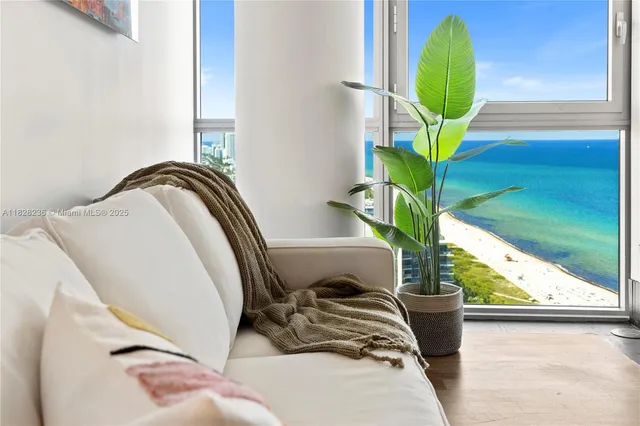 a living room with furniture and a table