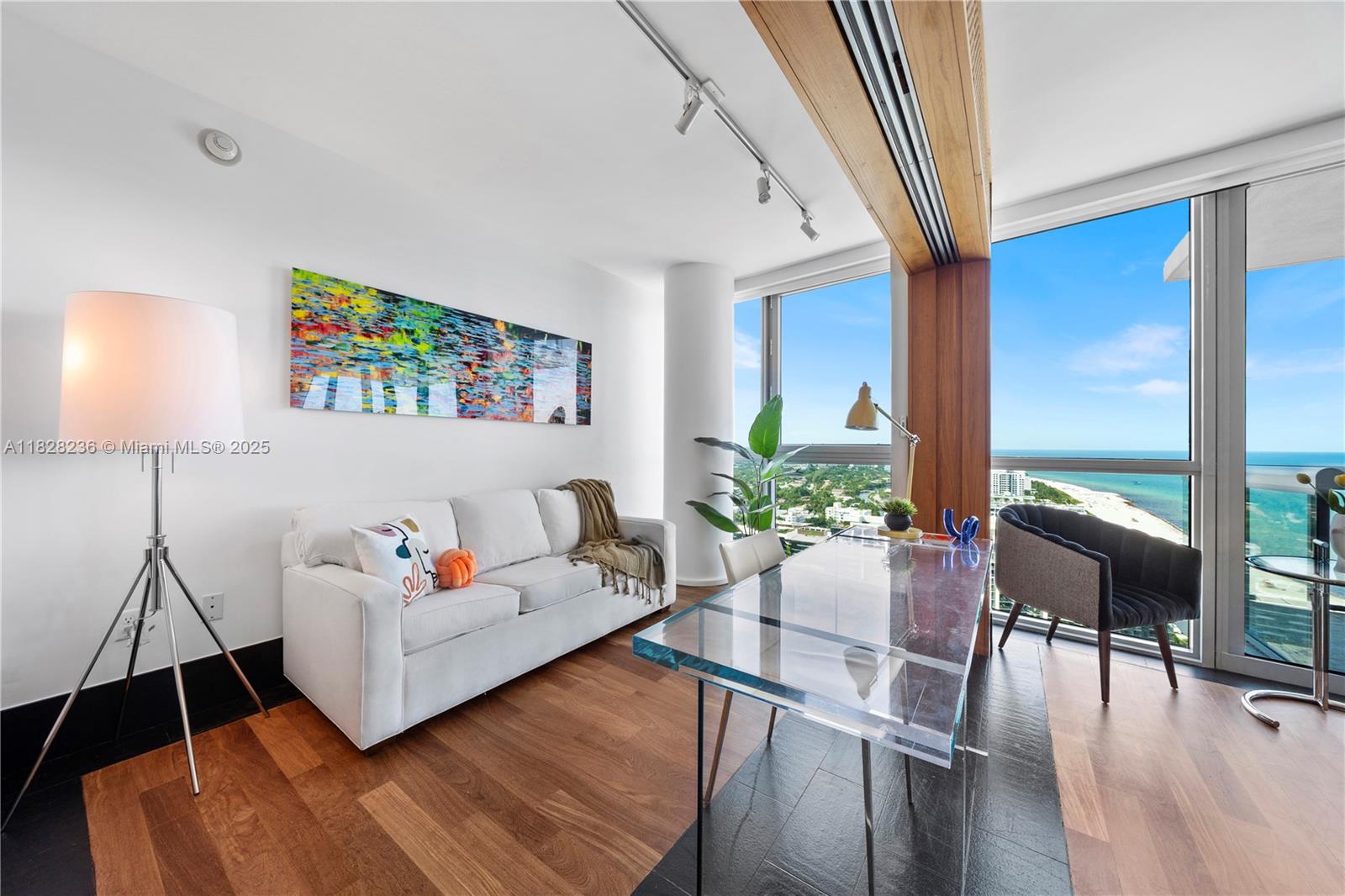 101 20th Street, Unit 3803 Miami Beach, FL 33139 - Photo 7 of 36 a living room with furniture and a table