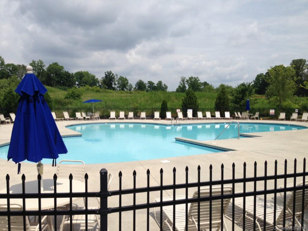 204 Falling Ridge, Unit 145 Belmont, NC 28012 - Photo 17 of 18 a view of swimming pool with a lake